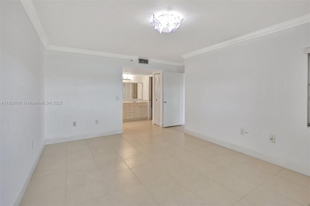 13800 SW 5th Ct Unit 101M, Pembroke Pines, FL 33027 - unfurnished room with ornamental molding and light tile patterned floors