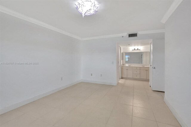 13800 SW 5th Ct Unit 101M, Pembroke Pines, FL 33027 - spare room with ornamental molding and baseboards