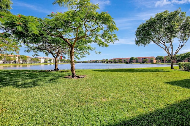 13800 SW 5th Ct Unit 101M, Pembroke Pines, FL 33027 - view of grassy yard featuring a water view