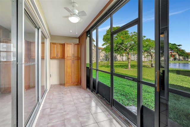 13800 SW 5th Ct Unit 101M, Pembroke Pines, FL 33027 - unfurnished sunroom featuring a ceiling fan and a water view