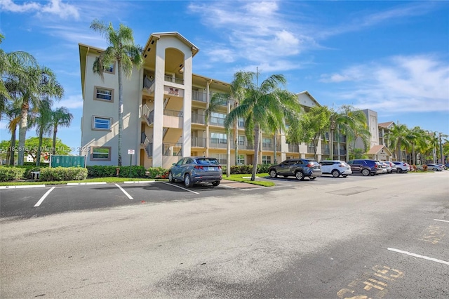 13800 SW 5th Ct Unit 101M, Pembroke Pines, FL 33027 - view of apartment building / complex with uncovered parking
