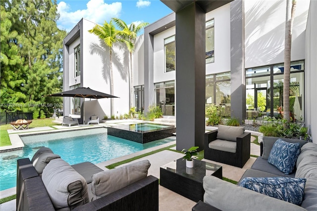 1009 NE 104th St, Miami Shores, FL 33138 - view of swimming pool with outdoor lounge area, a patio area, and a pool with connected hot tub