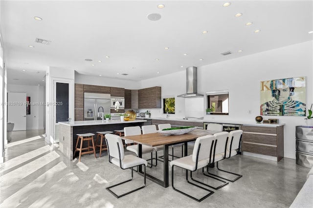 1009 NE 104th St, Miami Shores, FL 33138 - dining space with finished concrete floors and recessed lighting