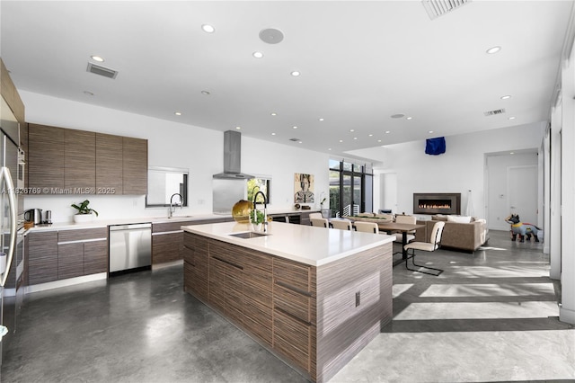 1009 NE 104th St, Miami Shores, FL 33138 - kitchen featuring stainless steel dishwasher, modern cabinets, finished concrete floors, wall chimney range hood, and recessed lighting