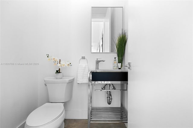 1009 NE 104th St, Miami Shores, FL 33138 - bathroom with toilet and baseboards