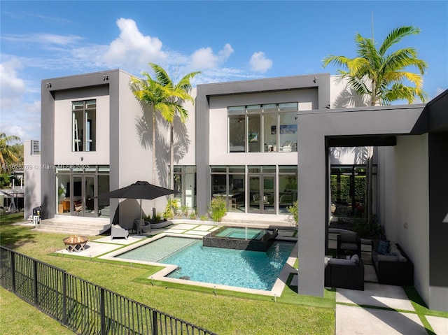 1009 NE 104th St, Miami Shores, FL 33138 - rear view of property with stucco siding, a patio area, and an outdoor hangout area
