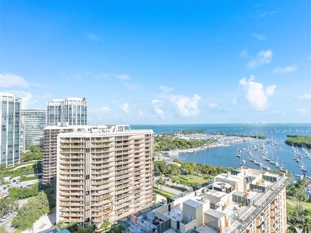 2889 Mcfarlane Rd Unit 1908, Miami, FL 33133 - view of urban area featuring a large body of water and apartment complex