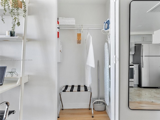 2889 Mcfarlane Rd Unit 1908, Miami, FL 33133 - spacious closet featuring light wood finished floors