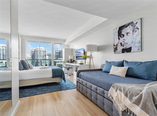 2889 Mcfarlane Rd Unit 1908, Miami, FL 33133 - bedroom featuring wood finished floors