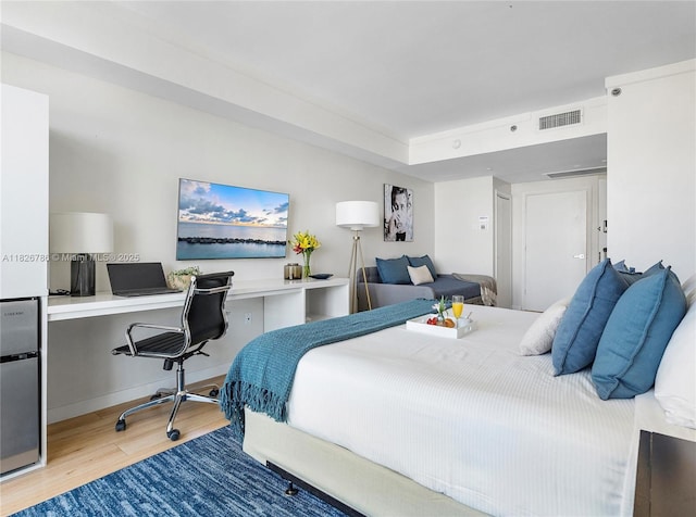 2889 Mcfarlane Rd Unit 1908, Miami, FL 33133 - bedroom with wood finished floors and a desk
