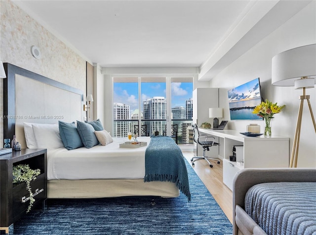 2889 Mcfarlane Rd Unit 1908, Miami, FL 33133 - bedroom with wood finished floors, an office area, and access to outside
