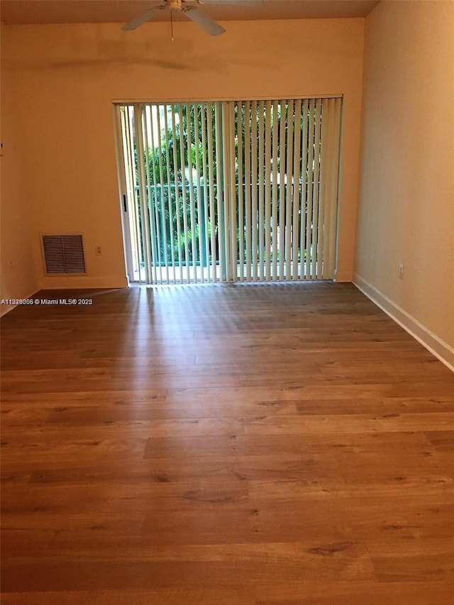 6001 SW 70th St Unit 324, South Miami, FL 33143 - spare room with a ceiling fan and wood finished floors