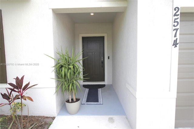 2574 SW Cameo Blvd, Port St Lucie, FL 34953 - entrance to property with electric panel and stucco siding
