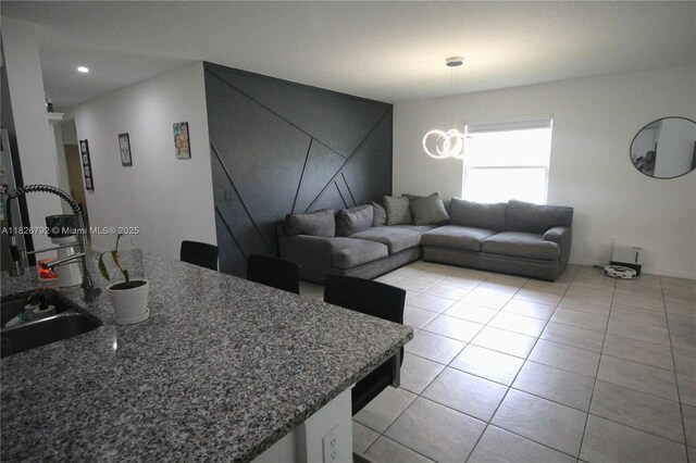 2574 SW Cameo Blvd, Port St Lucie, FL 34953 - living area with light tile patterned flooring and recessed lighting