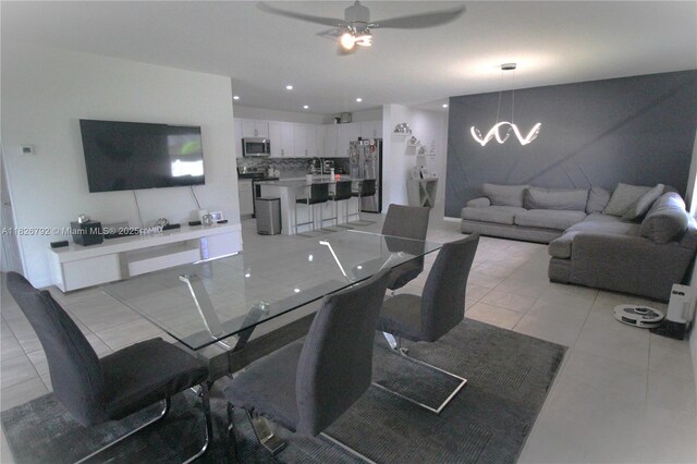 2574 SW Cameo Blvd, Port St Lucie, FL 34953 - dining space featuring ceiling fan, a chandelier, light tile patterned floors, and recessed lighting