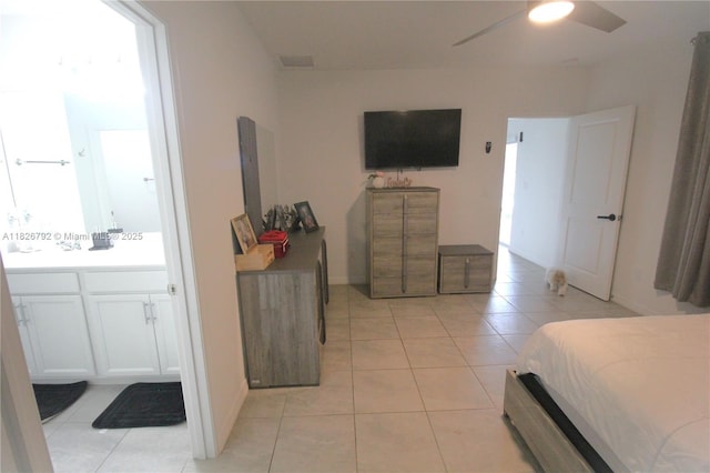 2574 SW Cameo Blvd, Port St Lucie, FL 34953 - bedroom with light tile patterned flooring and ceiling fan