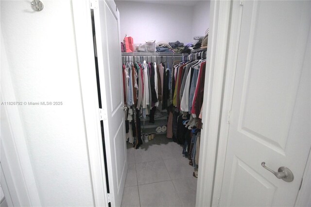 2574 SW Cameo Blvd, Port St Lucie, FL 34953 - walk in closet with light tile patterned flooring
