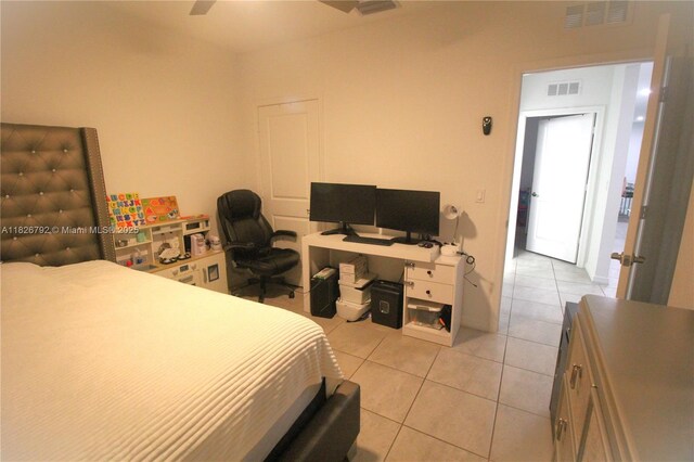 2574 SW Cameo Blvd, Port St Lucie, FL 34953 - bedroom with light tile patterned flooring and a ceiling fan