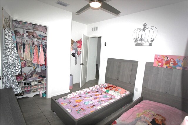 2574 SW Cameo Blvd, Port St Lucie, FL 34953 - tiled bedroom featuring a closet and ceiling fan