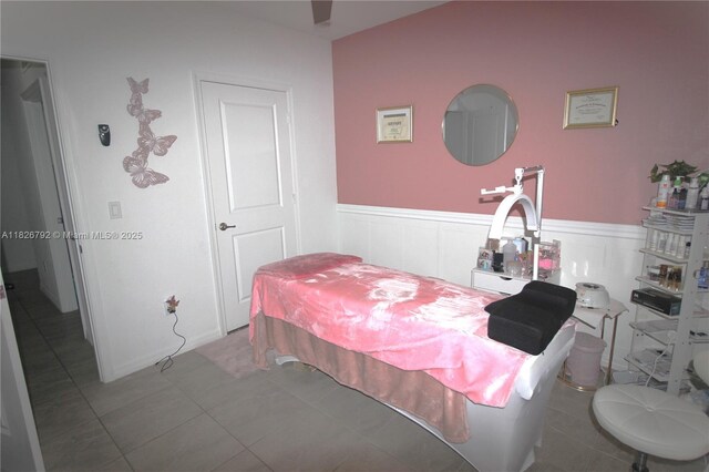 2574 SW Cameo Blvd, Port St Lucie, FL 34953 - bedroom with a wainscoted wall