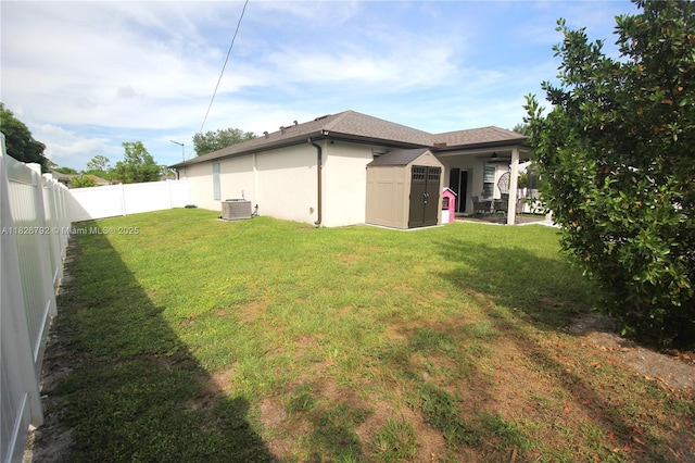 2574 SW Cameo Blvd, Port St Lucie, FL 34953 - fenced backyard with a storage shed and a ceiling fan