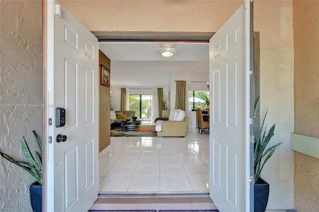 10030 SW 8th St, Pembroke Pines, FL 33025 - tiled foyer featuring a textured wall