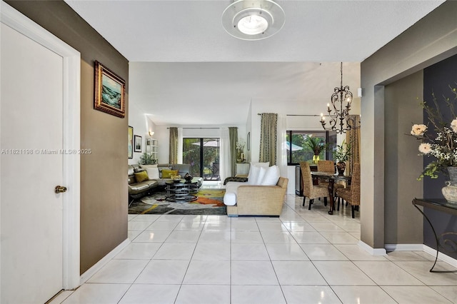10030 SW 8th St, Pembroke Pines, FL 33025 - tiled living room featuring a chandelier and baseboards