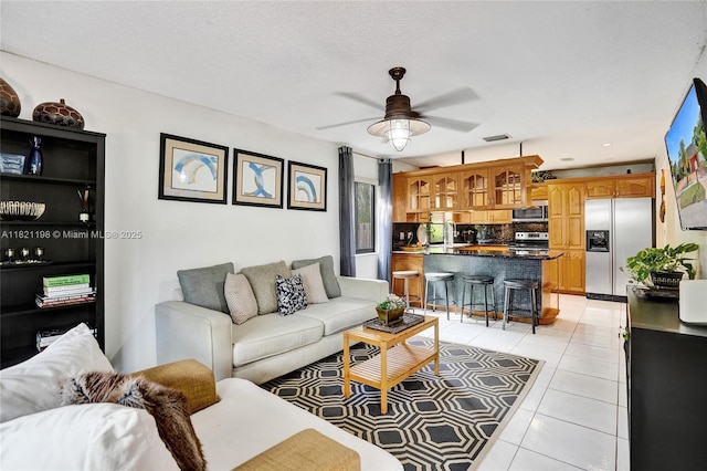10030 SW 8th St, Pembroke Pines, FL 33025 - living area featuring light tile patterned floors and ceiling fan
