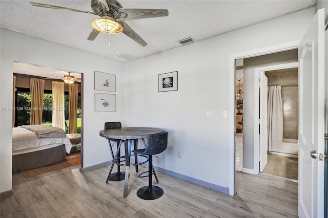 10030 SW 8th St, Pembroke Pines, FL 33025 - dining space with ceiling fan, wood finished floors, and a textured ceiling