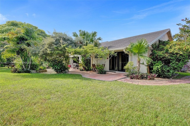 10030 SW 8th St, Pembroke Pines, FL 33025 - back of house featuring a yard, a patio, and stucco siding