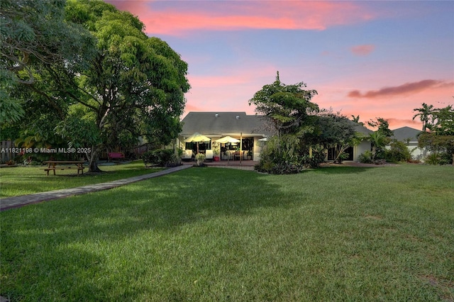 10030 SW 8th St, Pembroke Pines, FL 33025 - rear view of property featuring a lawn and a patio
