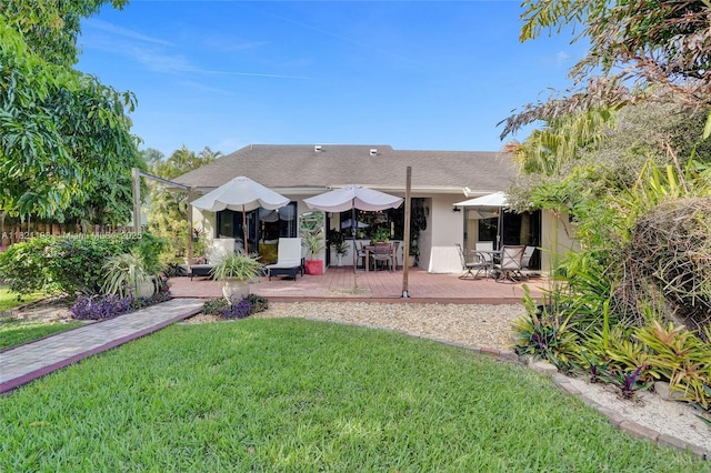 10030 SW 8th St, Pembroke Pines, FL 33025 - rear view of house featuring a lawn, a deck, outdoor dining area, and stucco siding