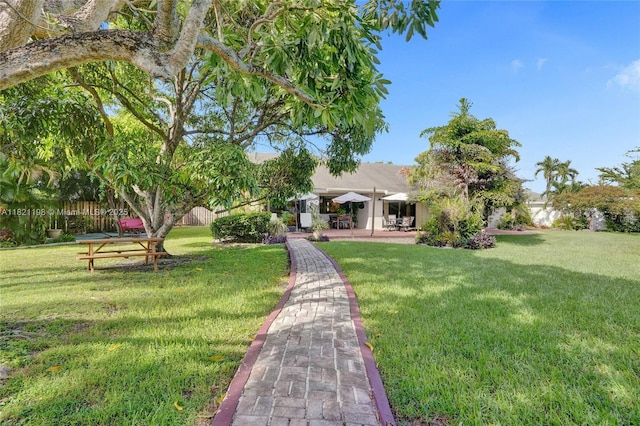 10030 SW 8th St, Pembroke Pines, FL 33025 - view of green lawn with a patio area