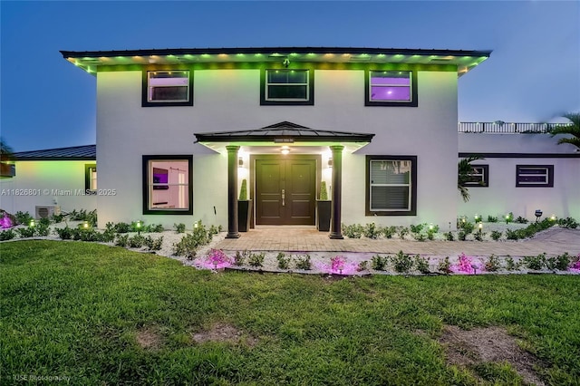 12220 Tara Dr, Plantation, FL 33325 - view of front of house with a standing seam roof, stucco siding, a metal roof, and a front lawn