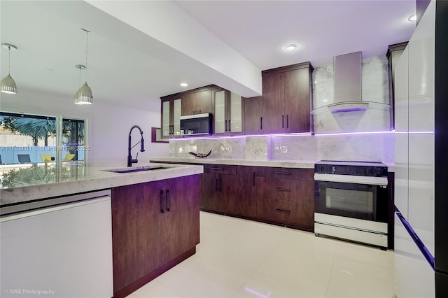 12220 Tara Dr, Plantation, FL 33325 - kitchen featuring wall chimney exhaust hood, electric stove, dishwashing machine, decorative backsplash, and decorative light fixtures
