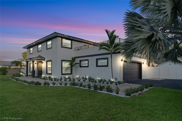 12220 Tara Dr, Plantation, FL 33325 - view of front of property with stucco siding, an attached garage, a balcony, and driveway