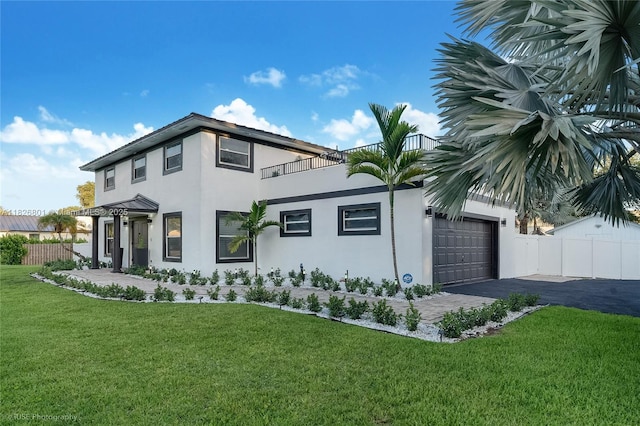 12220 Tara Dr, Plantation, FL 33325 - view of front of property with a balcony, stucco siding, an attached garage, and asphalt driveway