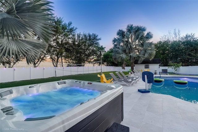 12220 Tara Dr, Plantation, FL 33325 - view of pool with a hot tub, a fenced backyard, a patio area, and an outbuilding