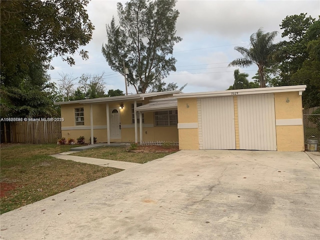 1624 NE 48th Ct, Pompano Beach, FL 33064 - view of front facade with driveway and stucco siding