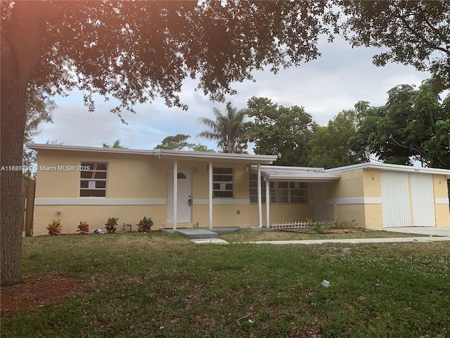 1624 NE 48th Ct, Pompano Beach, FL 33064 - view of front of property with stucco siding and a front lawn