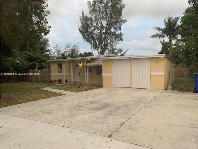 1624 NE 48th Ct, Pompano Beach, FL 33064 - view of front of property with concrete driveway and stucco siding