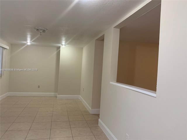 1624 NE 48th Ct, Pompano Beach, FL 33064 - spare room with light tile patterned floors and baseboards