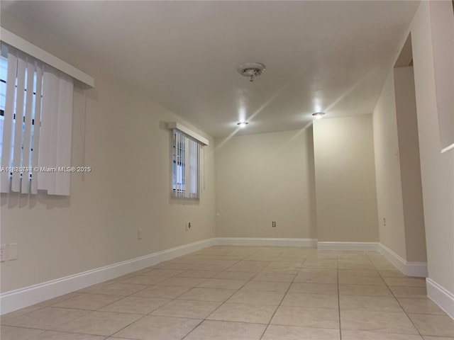 1624 NE 48th Ct, Pompano Beach, FL 33064 - spare room featuring light tile patterned floors and baseboards