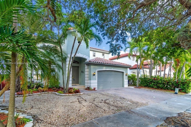 6425 SW 164th Ave, Miami, FL 33193 - mediterranean / spanish house featuring driveway, a tiled roof, stucco siding, and a garage