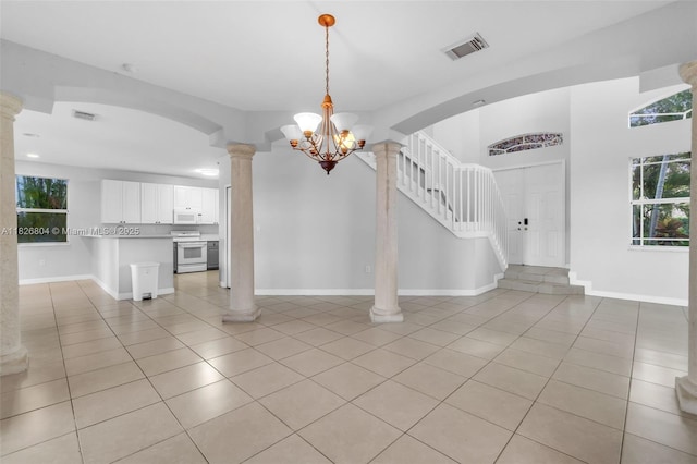 6425 SW 164th Ave, Miami, FL 33193 - entrance foyer with decorative columns, light tile patterned floors, and arched walkways