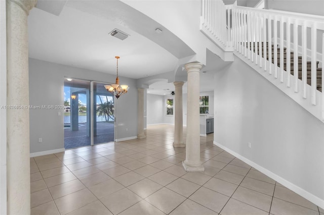 6425 SW 164th Ave, Miami, FL 33193 - tiled spare room with decorative columns and a chandelier
