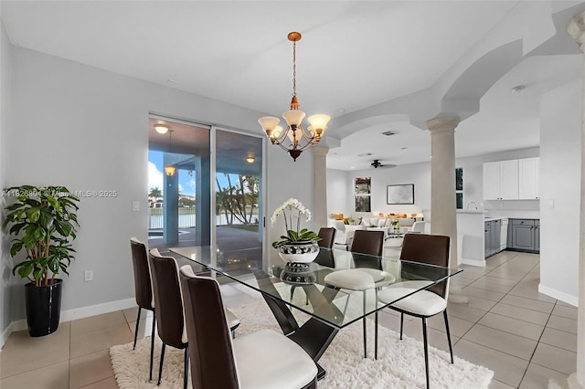 6425 SW 164th Ave, Miami, FL 33193 - dining space featuring ornate columns, light tile patterned floors, a chandelier, arched walkways, and a ceiling fan