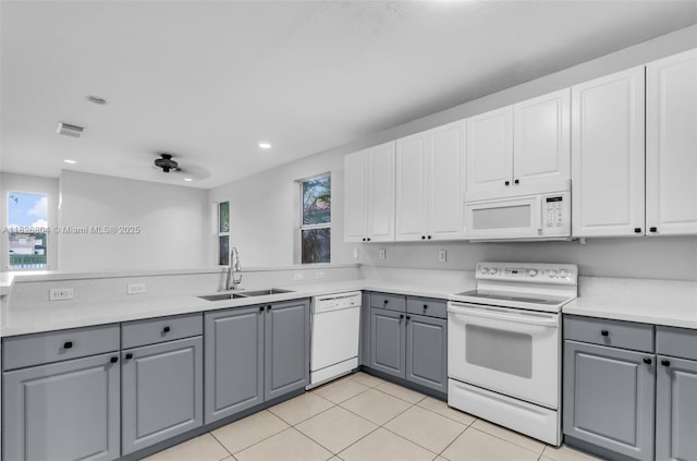 6425 SW 164th Ave, Miami, FL 33193 - kitchen featuring gray cabinetry, white appliances, recessed lighting, light tile patterned floors, and light countertops