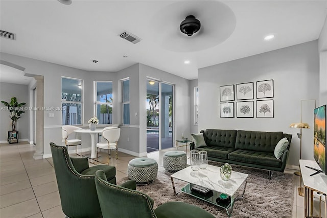6425 SW 164th Ave, Miami, FL 33193 - living area featuring light tile patterned floors, arched walkways, ceiling fan, and recessed lighting