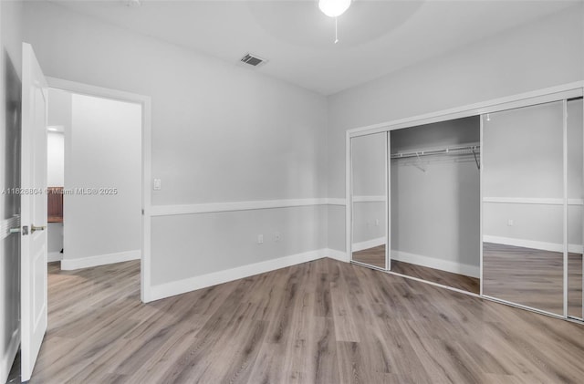 6425 SW 164th Ave, Miami, FL 33193 - unfurnished bedroom featuring wood finished floors, a closet, and a ceiling fan